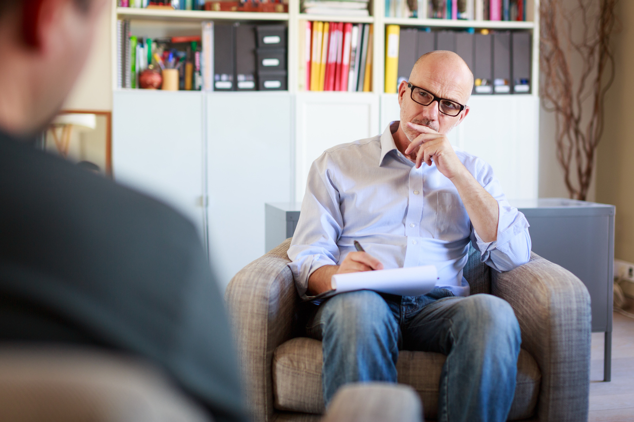 psychiatrist listening to a patient