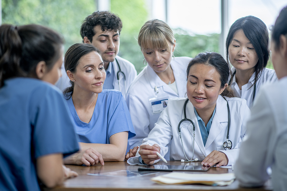 a group of residents gathering in a hospital