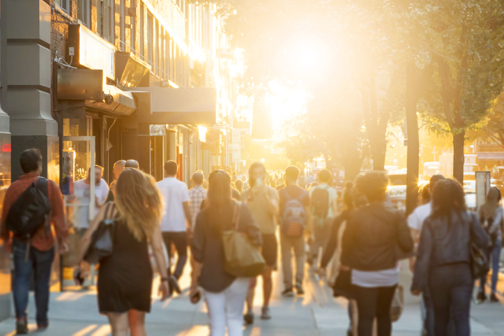 Crowd of people walking on a city street