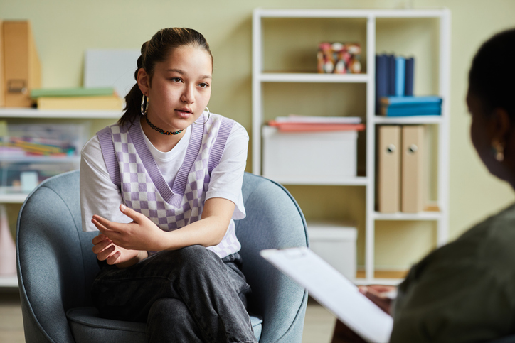 psychiatrist talking to a young woman