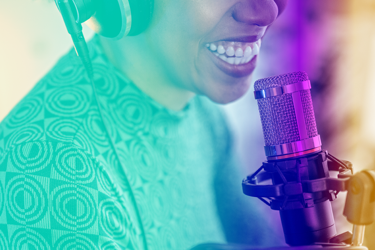 Woman speaking into microphone